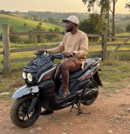 young man riding a bike on the country side