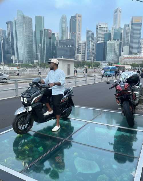 young man on a bike over a roof of glass