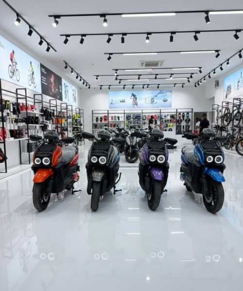 four bikes front side, different colors in a white clean store